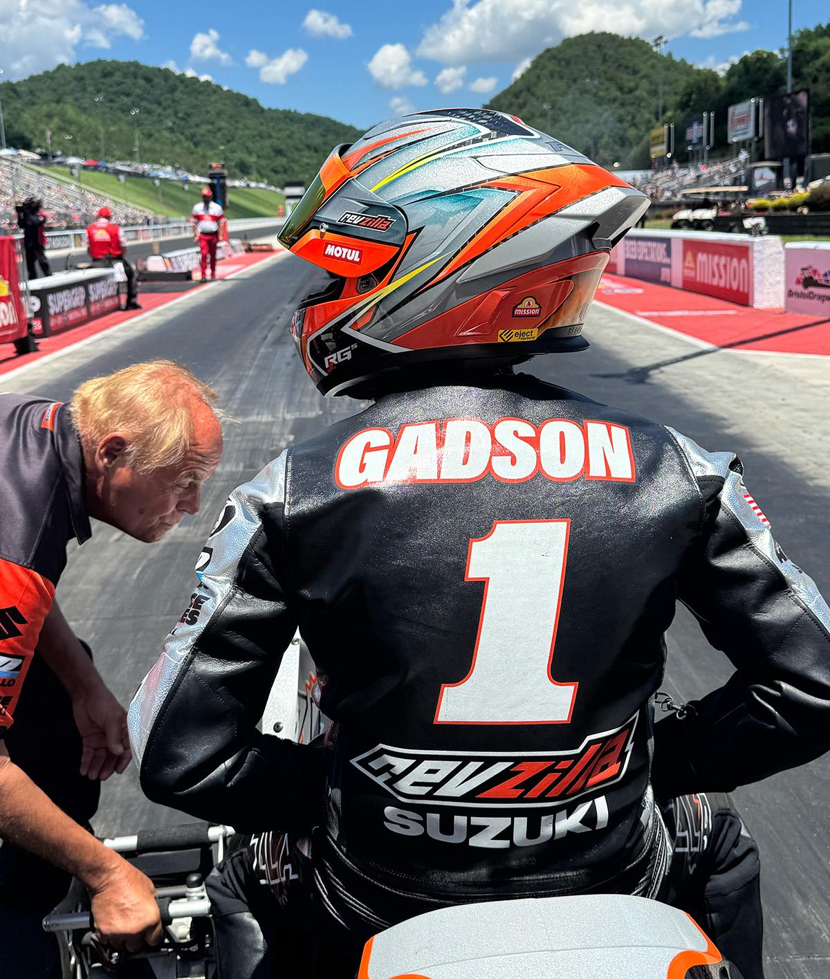 IMG_2565-sm | Vance & Hines Motorsports Racing rider seen from behind in a black leather suit with the name GADSON and number 1, in the pit lane before a race.